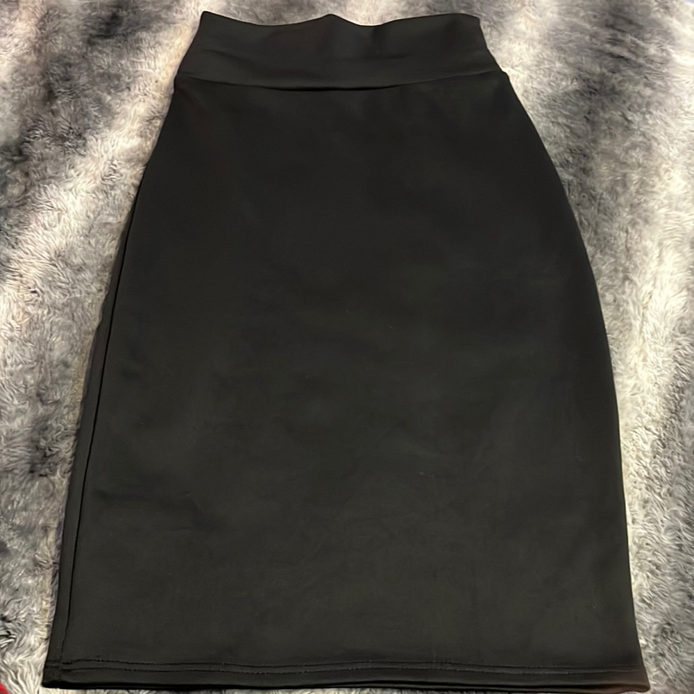 Black knee length skirt.